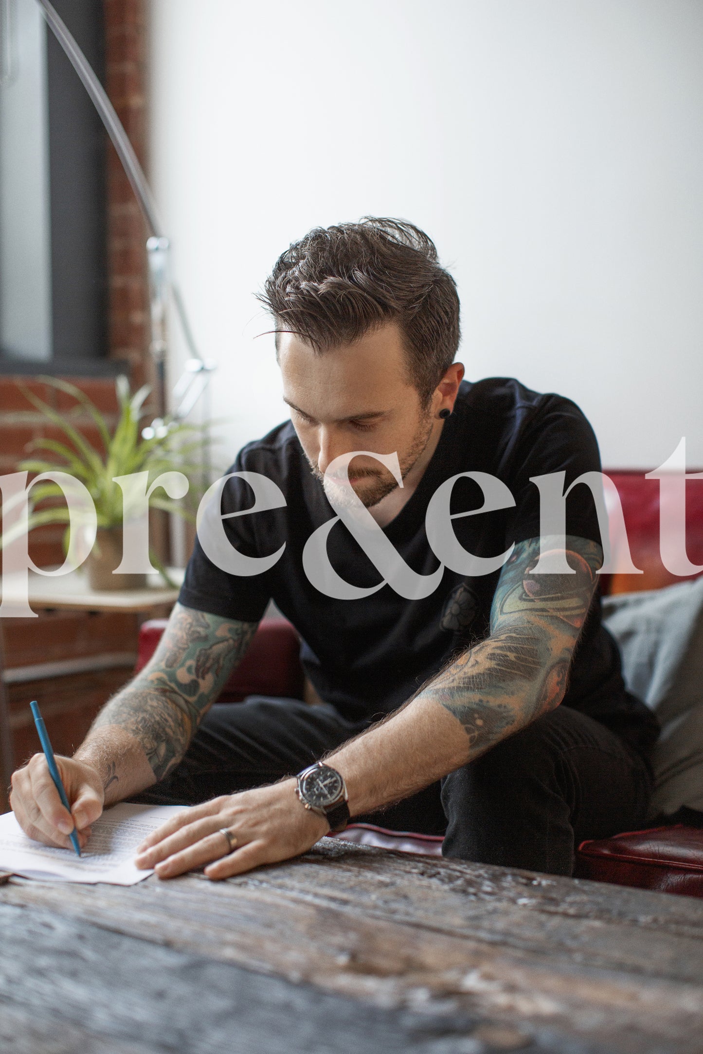 Person writing while sitting on a couch
