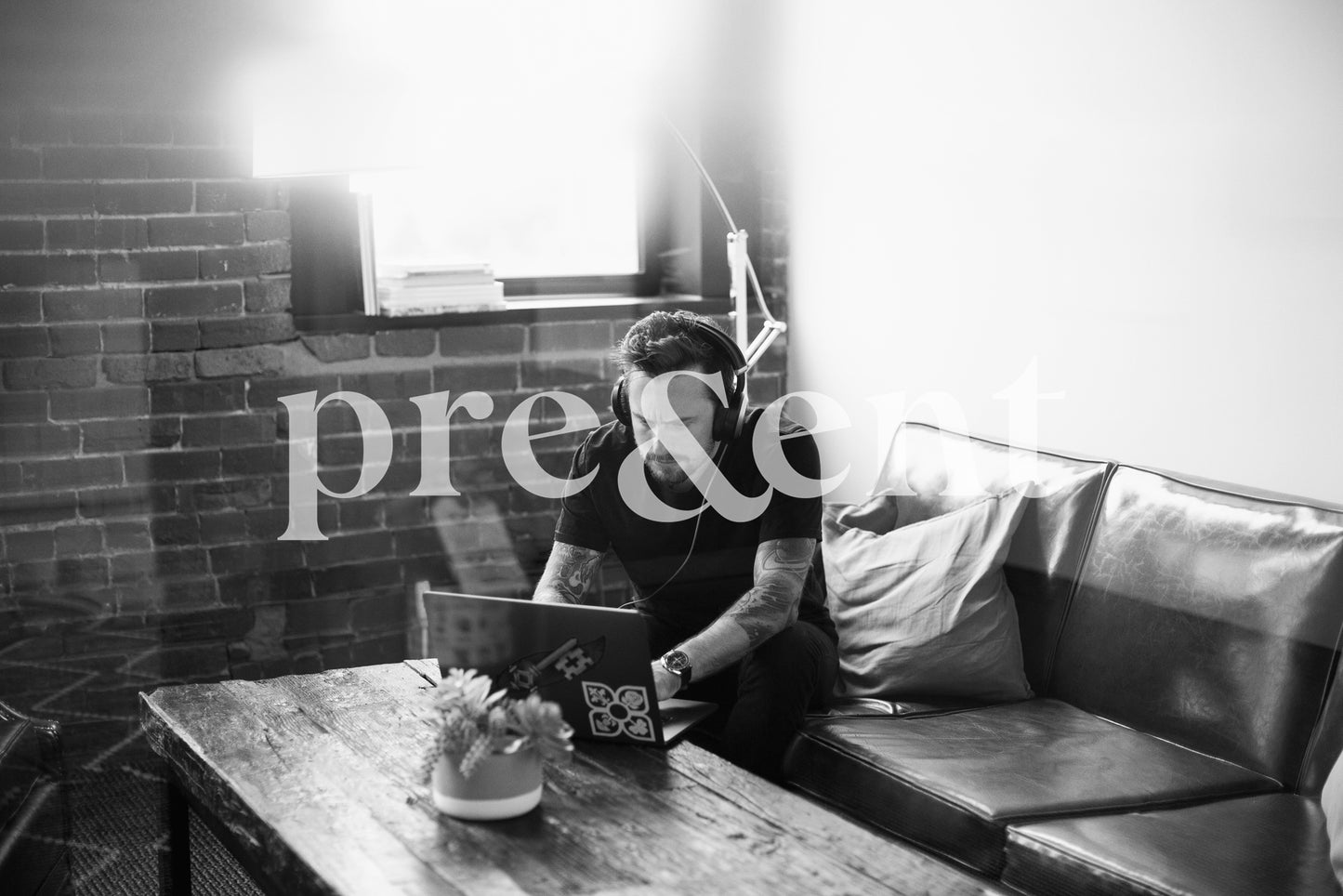 Person focused on computer, sitting in living room