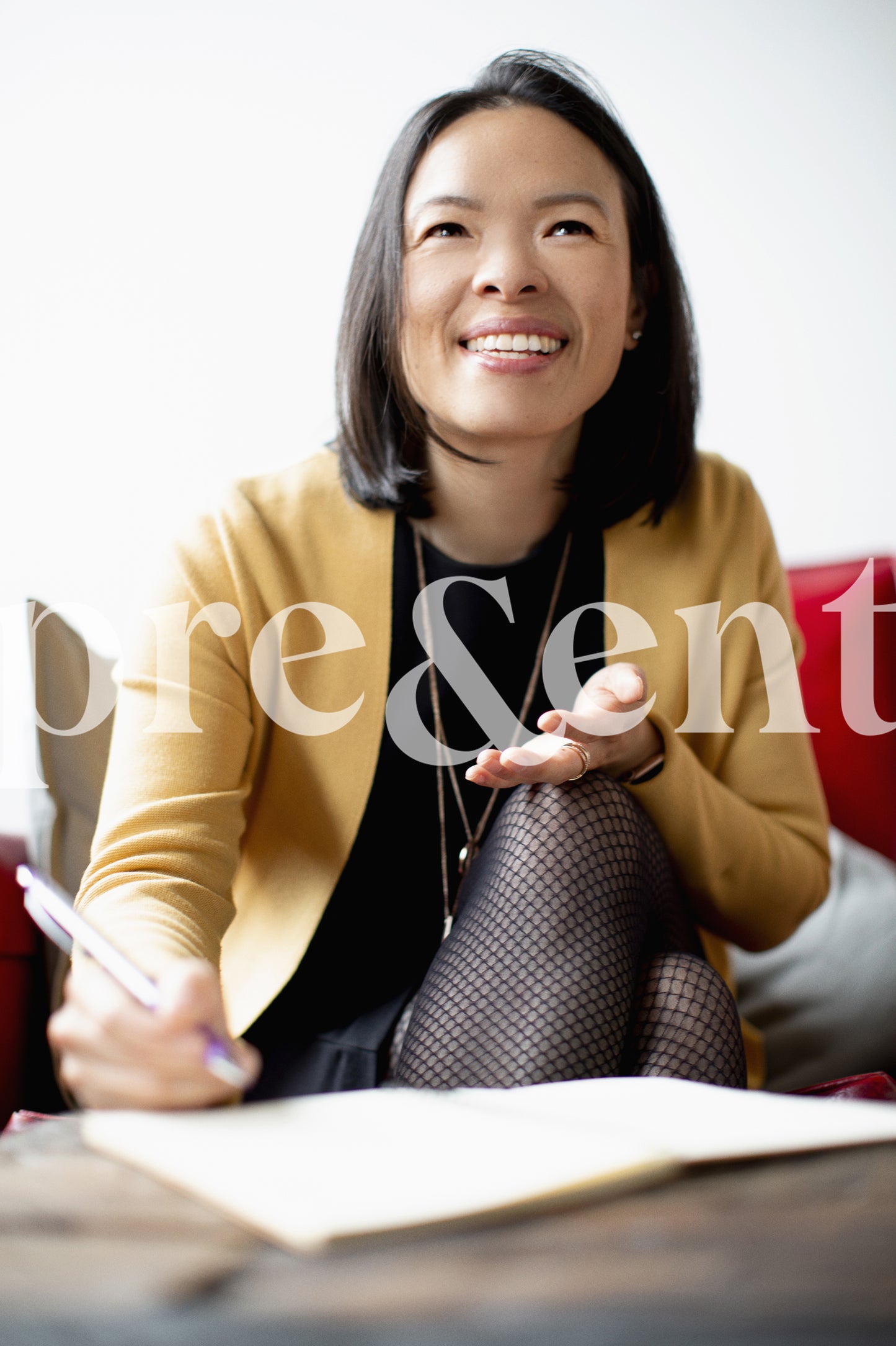 Smiling person taking notes