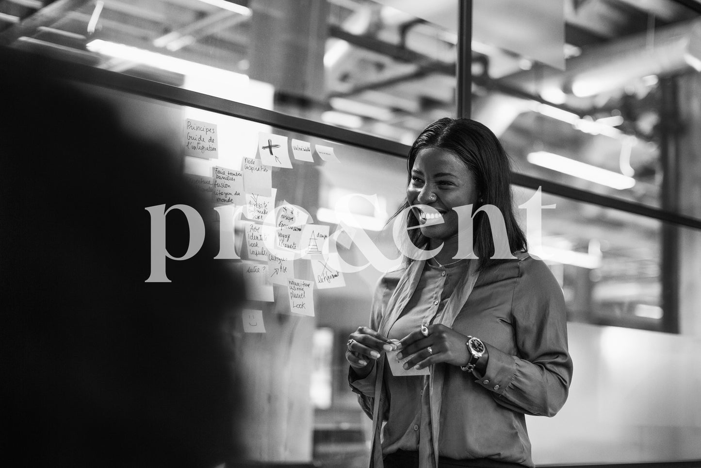 Smiling person contributing to a brainstorm
