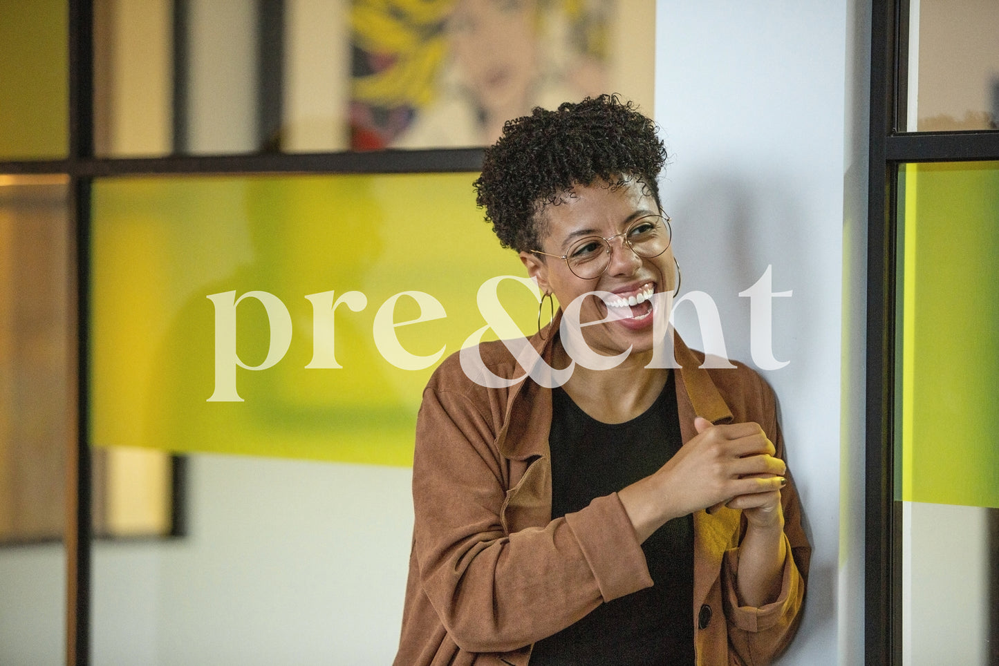 Smiling person leaning on wall