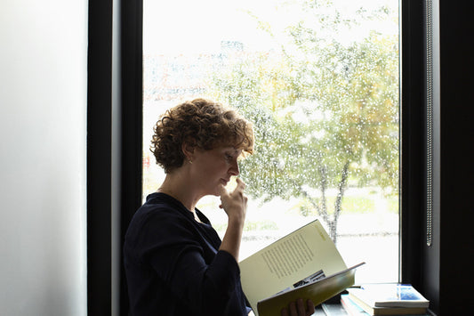 Reading by the window
