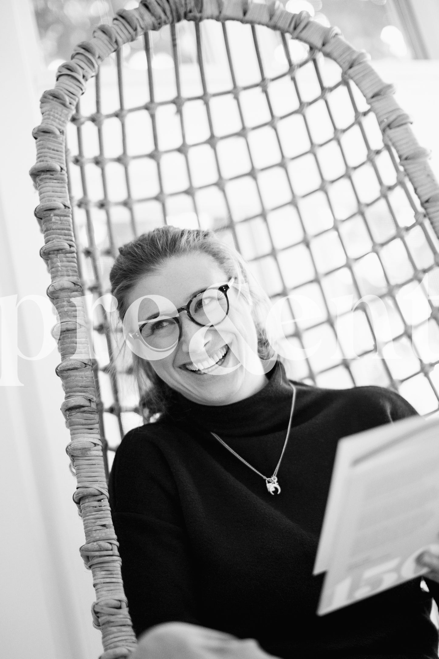 Person smiling while reading a book