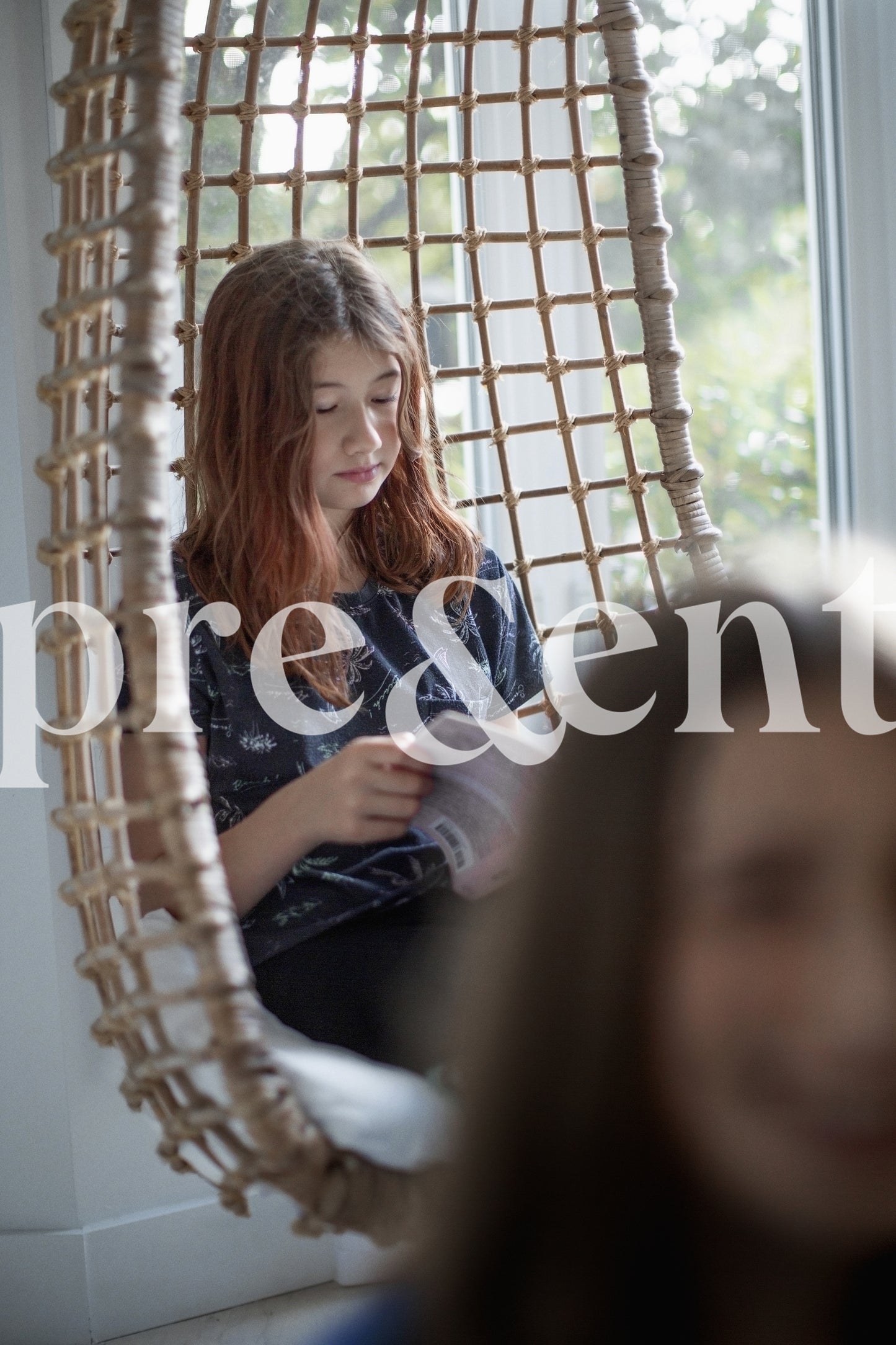 Kid reading in a comfy chair