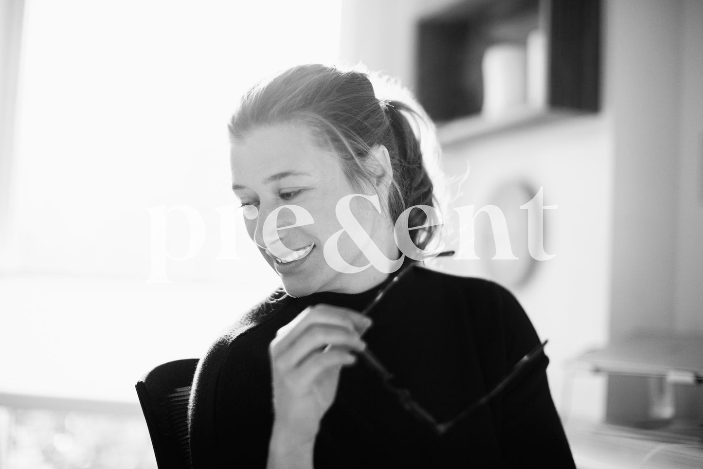 Someone taking their glasses off to look at something