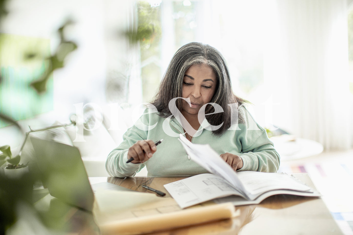 Person looking at papers, ready to take notes
