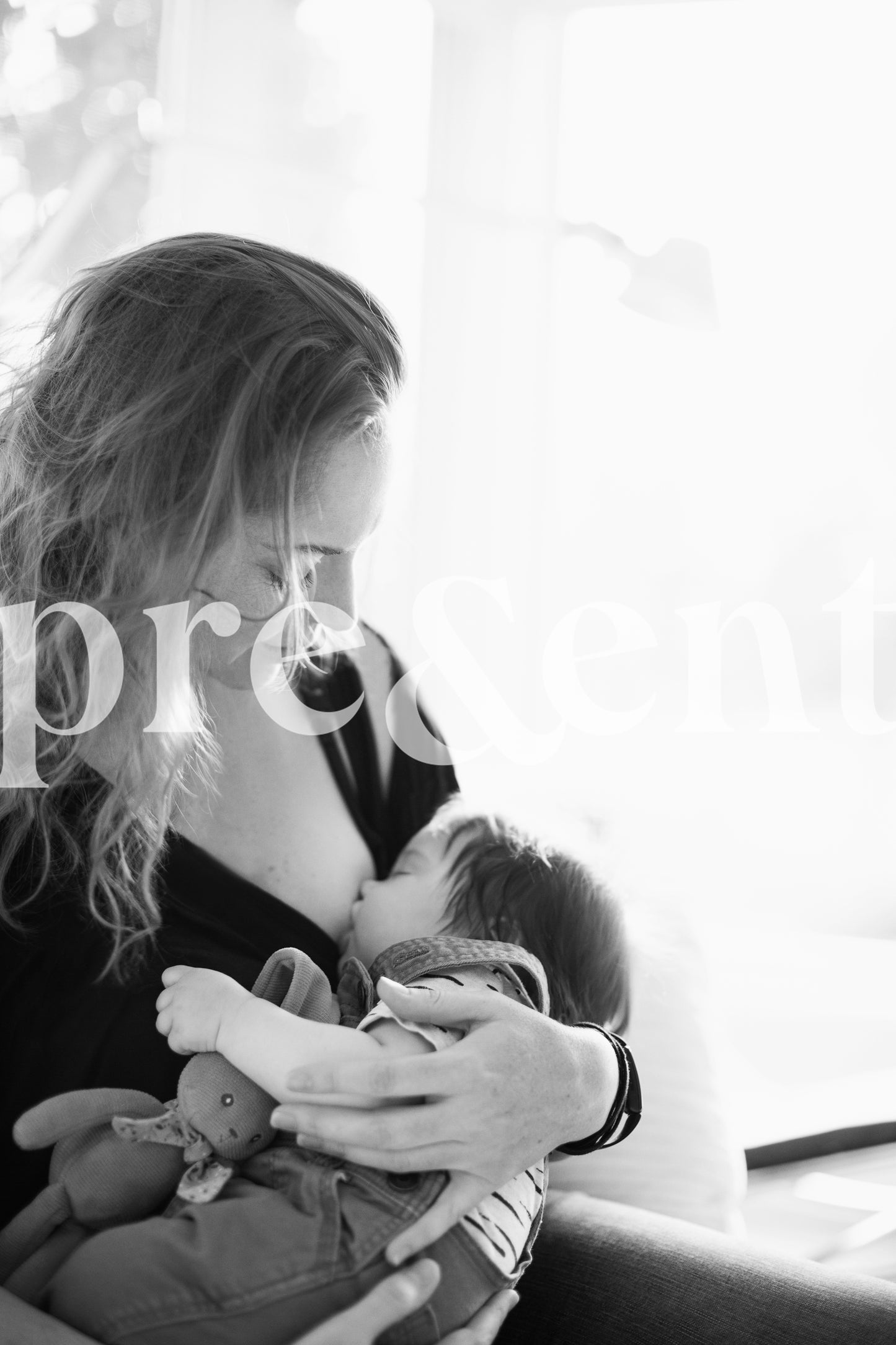 Parent holding their breast feeding baby