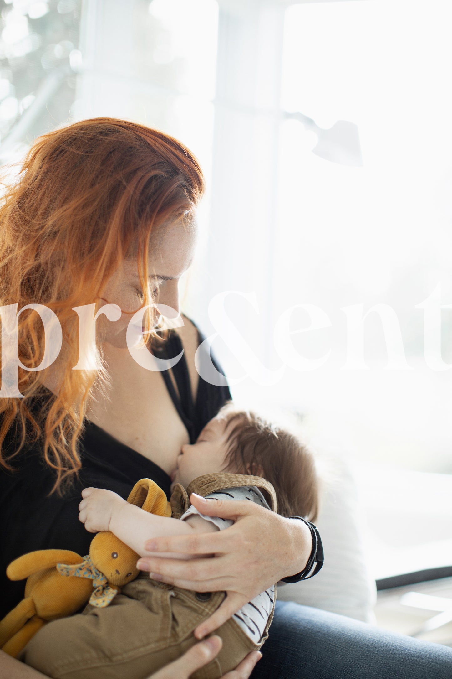 Parent holding their breast feeding baby