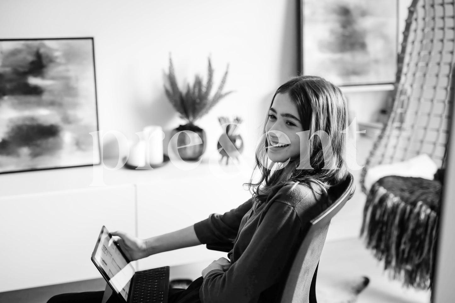 Smiling teenager on their tablet