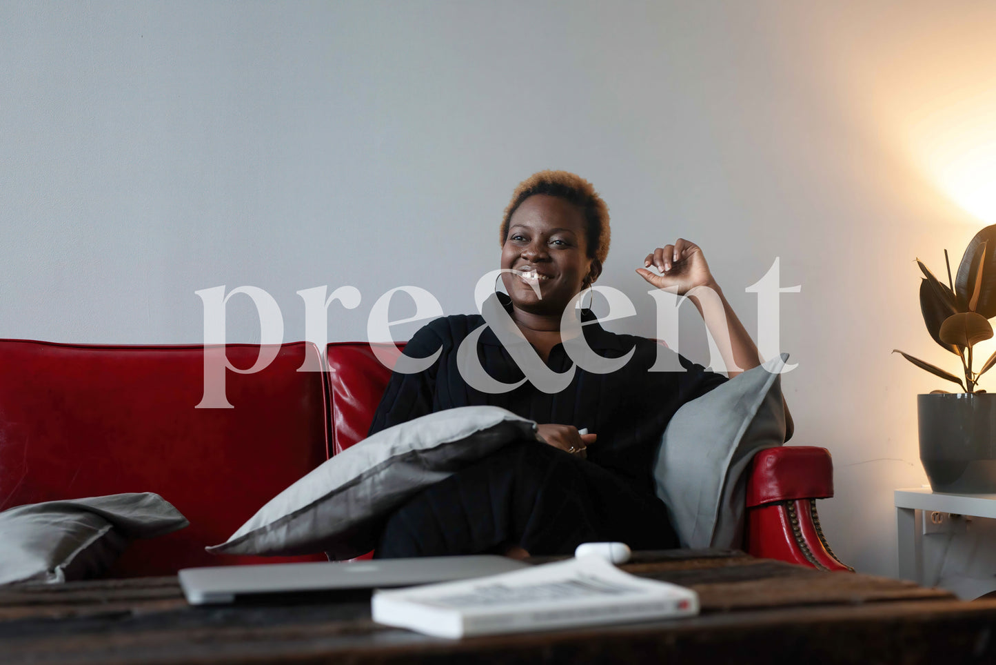 Smiling person sitting on a couch