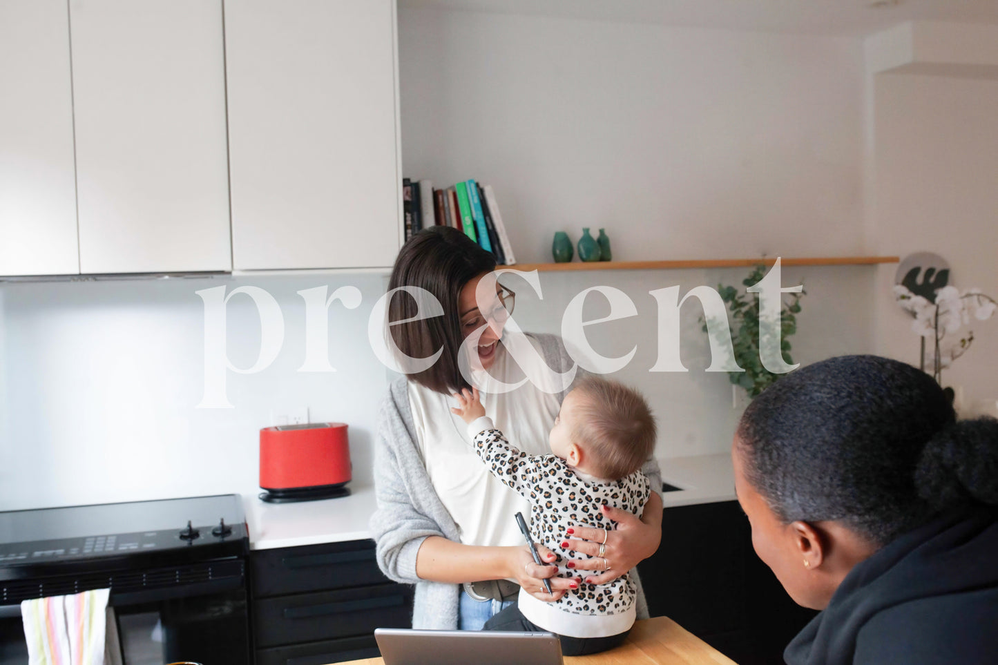 Happy baby reaching out to their parent