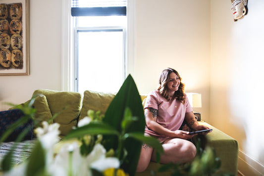 Smiling person on a couch