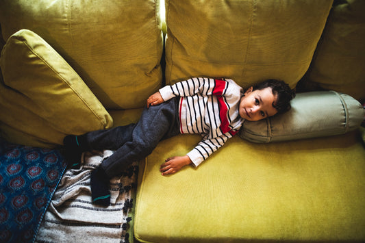 Child lounging in a sofa