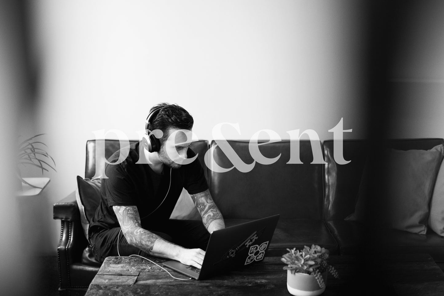 Person working on computer on living room couch