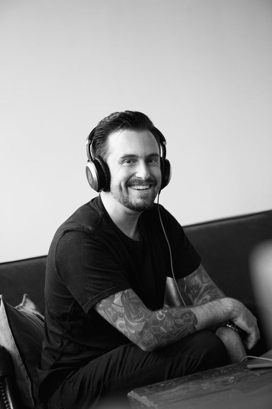 Smiling person with headphones on