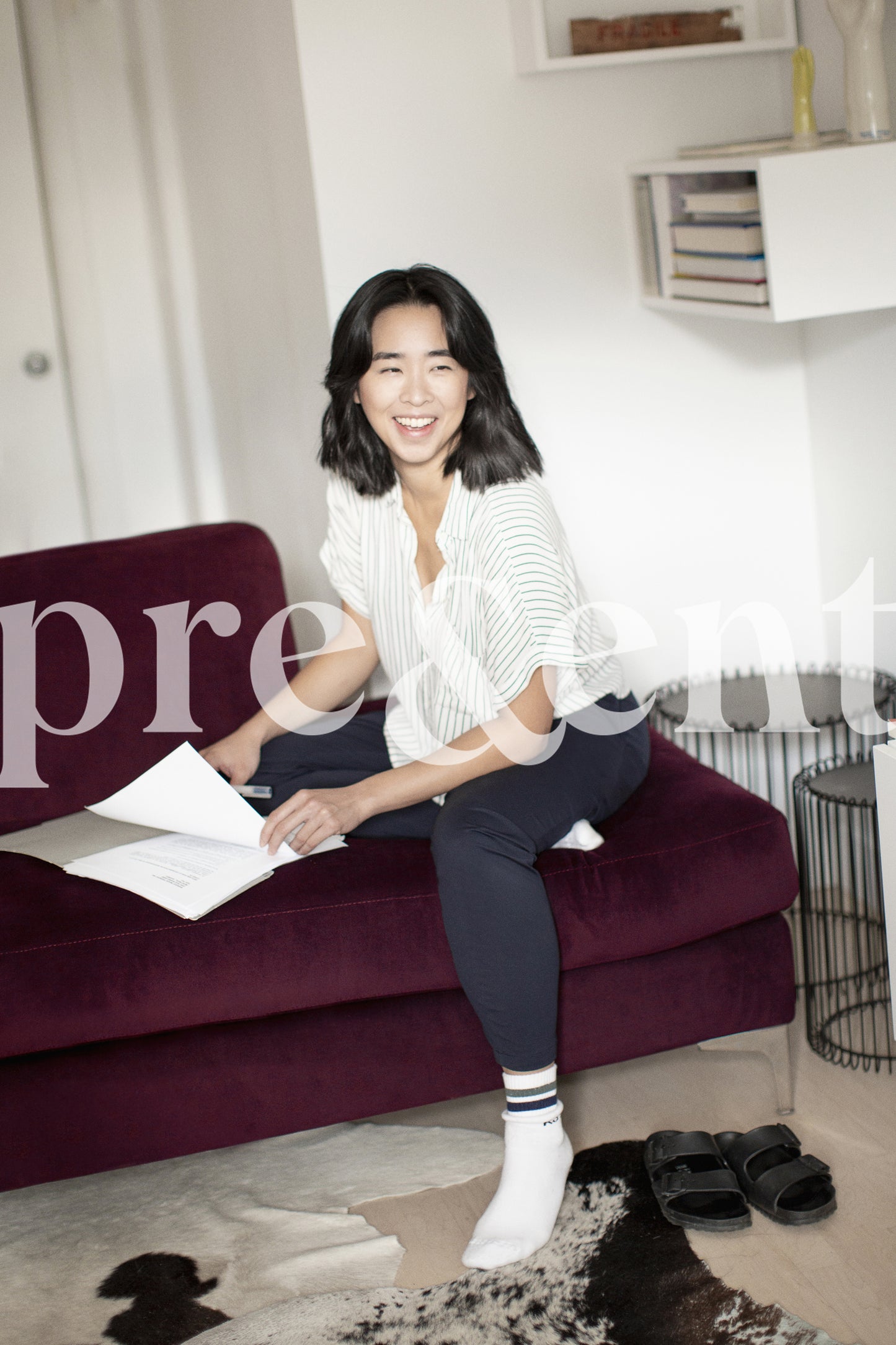 Joyful person sorting papers on a couch