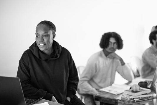 Reading on a computer while working with colleagues