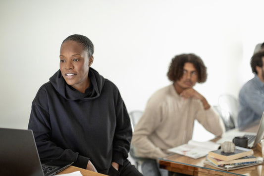 Reading on a computer while working with colleagues