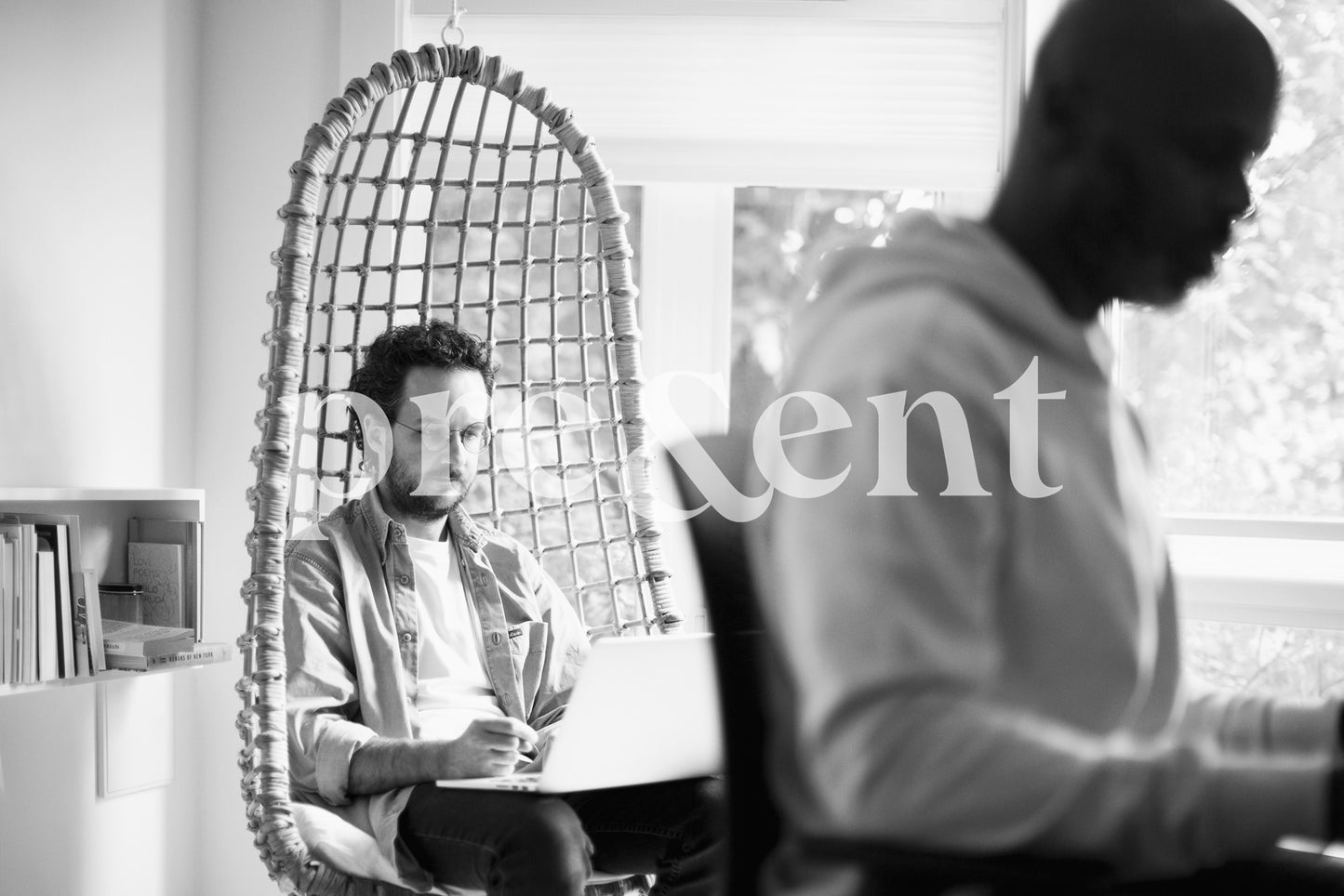 Someone focusing on work in a hanging chair
