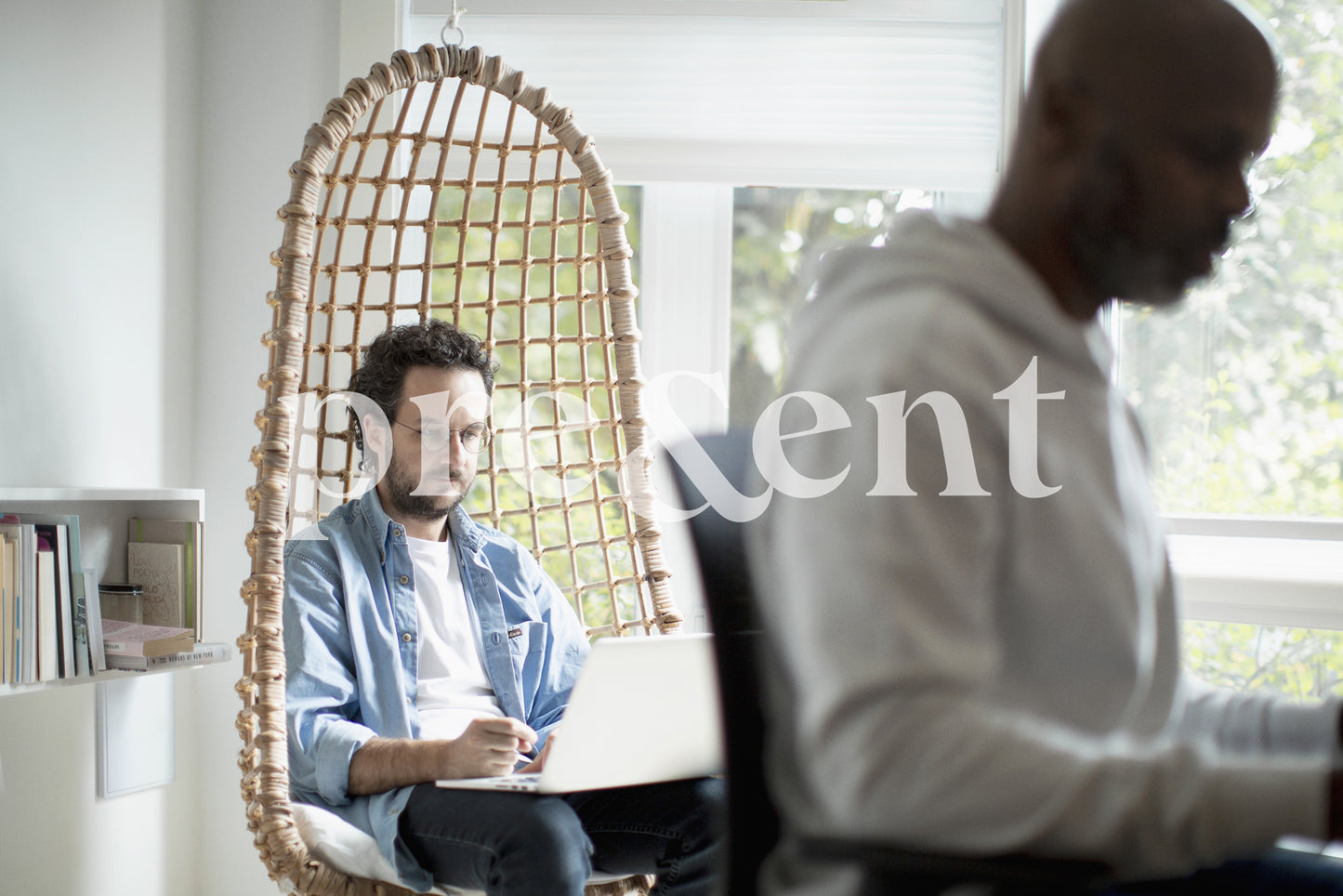 Someone focusing on work in a hanging chair