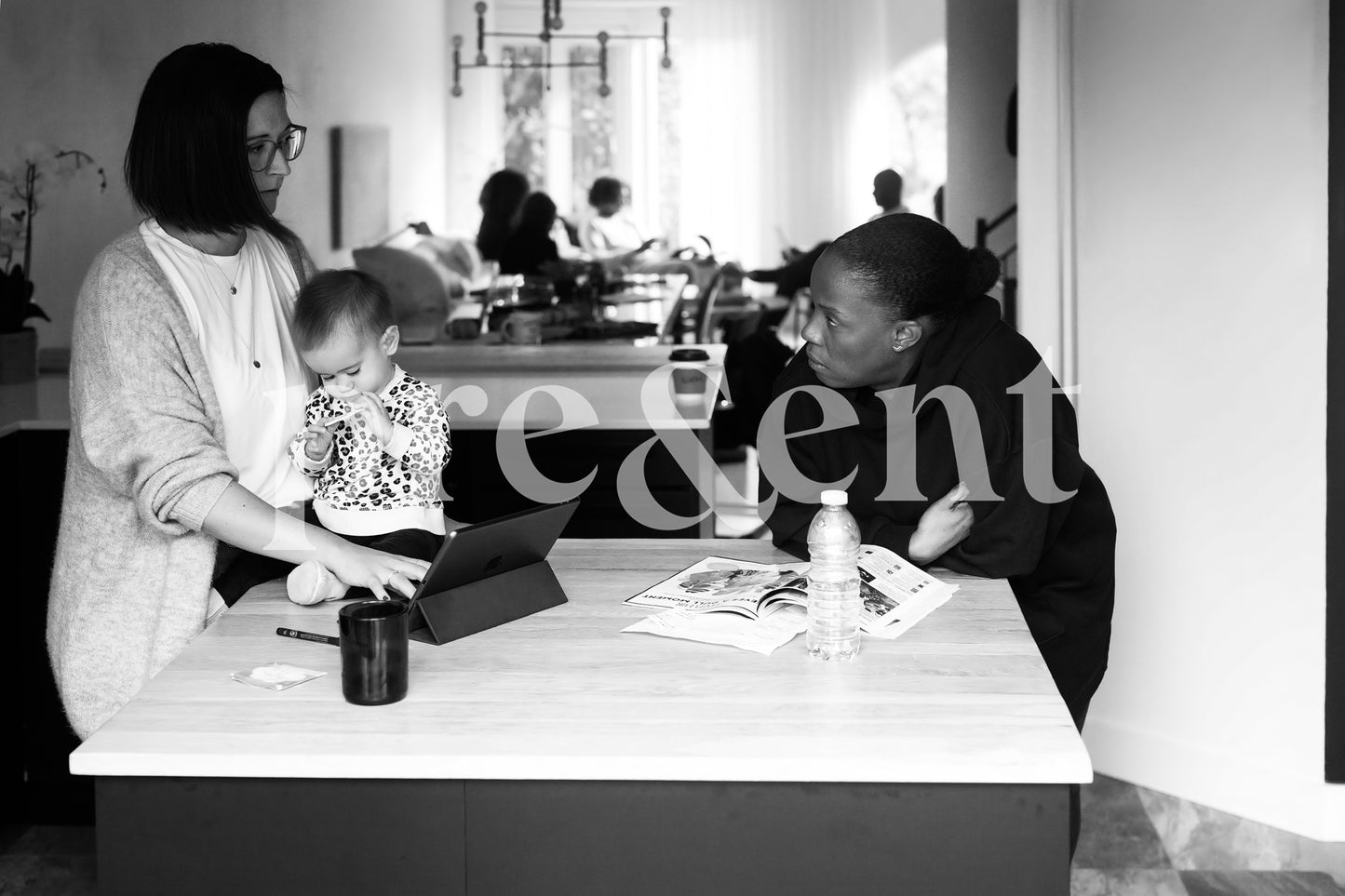 Friends casually discussing in the kitchen