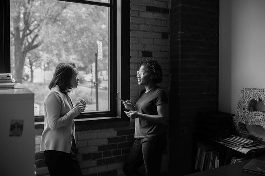 Impromptu chat by the office window